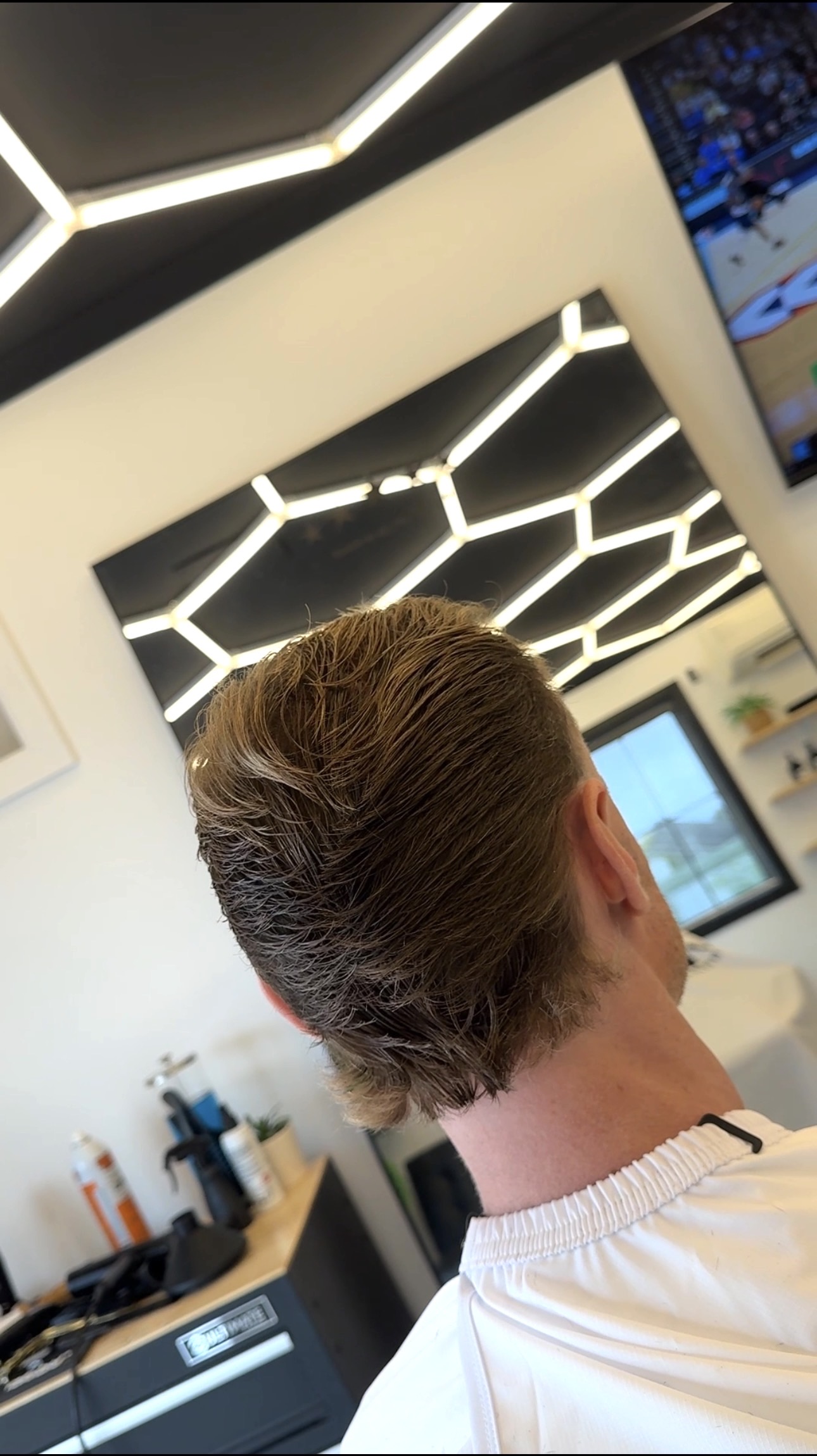 Blow dried textured mullet under the studio lights