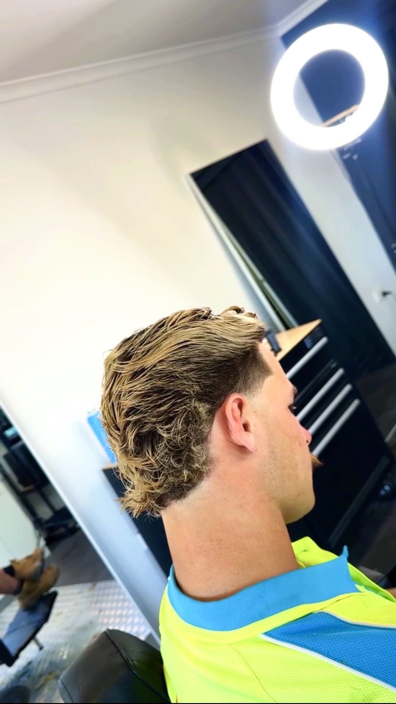 Fade and mullet cut for a customer in work gear